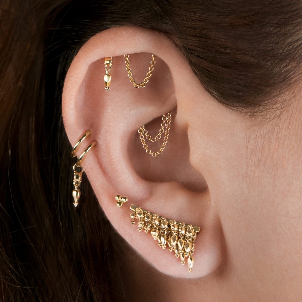 18K gold threaded studs and traditional studs in lobe, cartilage, and Helix piercing placements